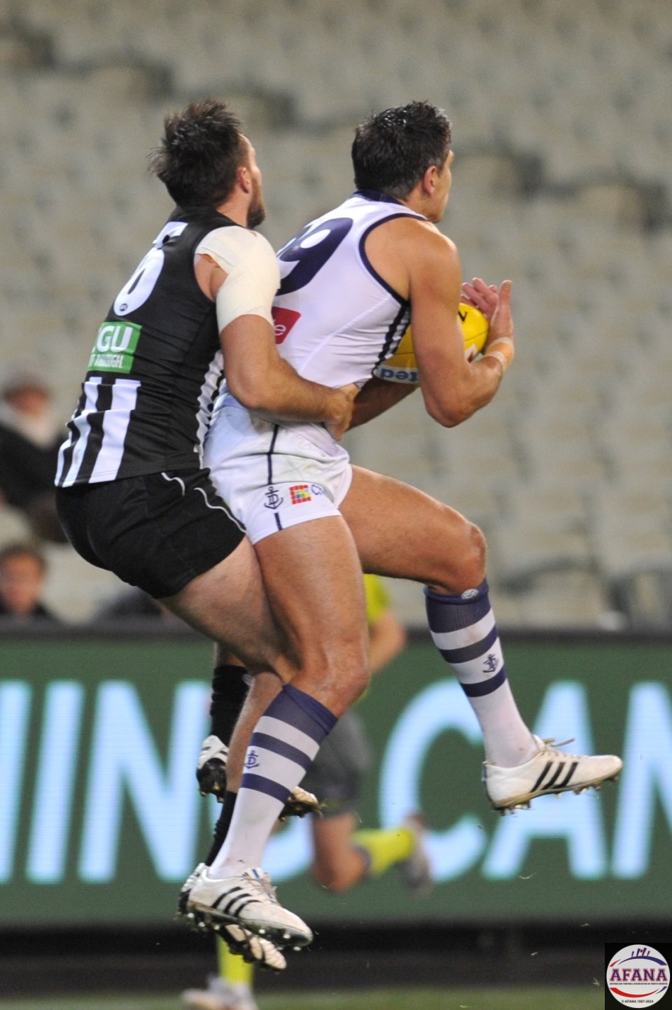 Matthew Pavlich playing his last game on the MCG, marks in front of Nathan Brown