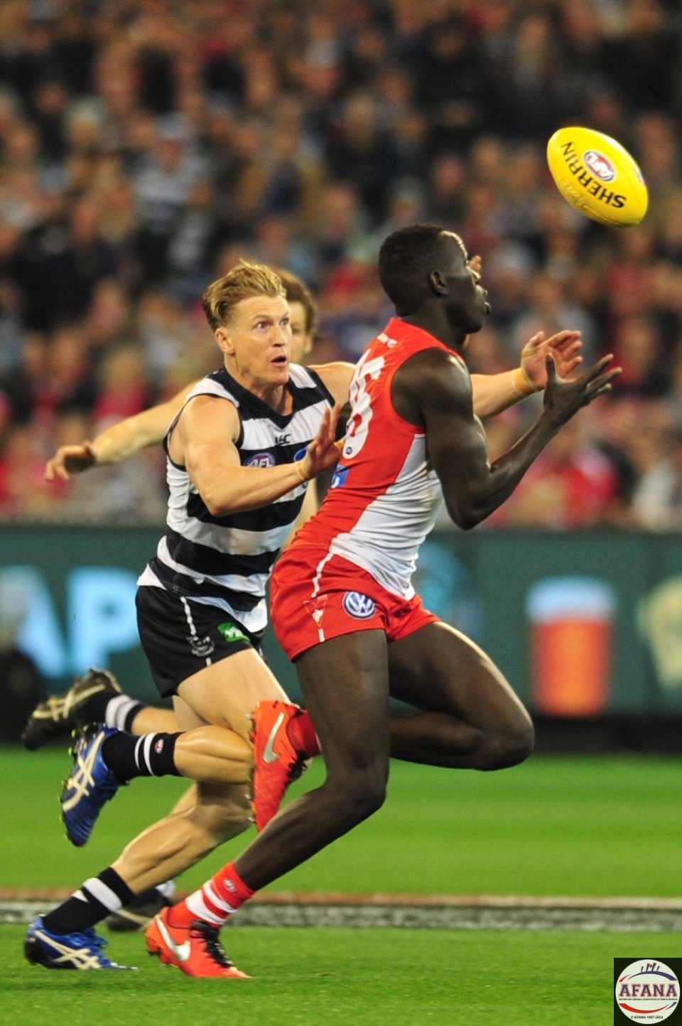 Aliir bursts through running the ball out of the Swans defence