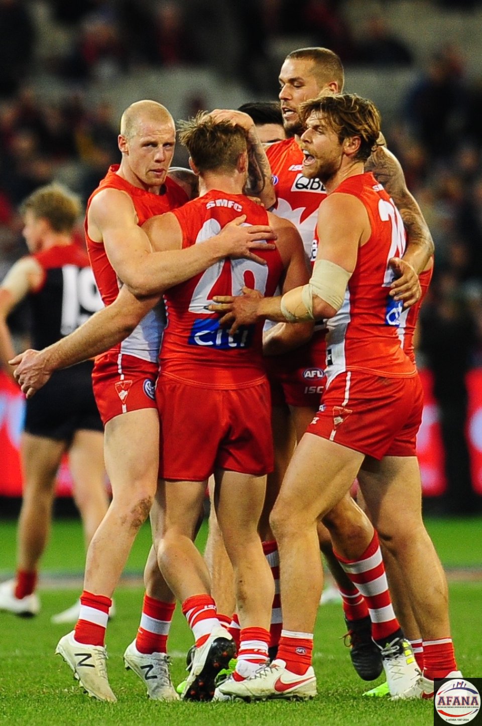 Luke Parker is mobbed by his team mates