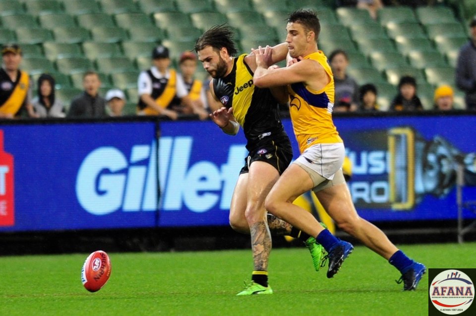 Ben Lennon in the forward procket for the Tigers is under pressure from the Eagles defence