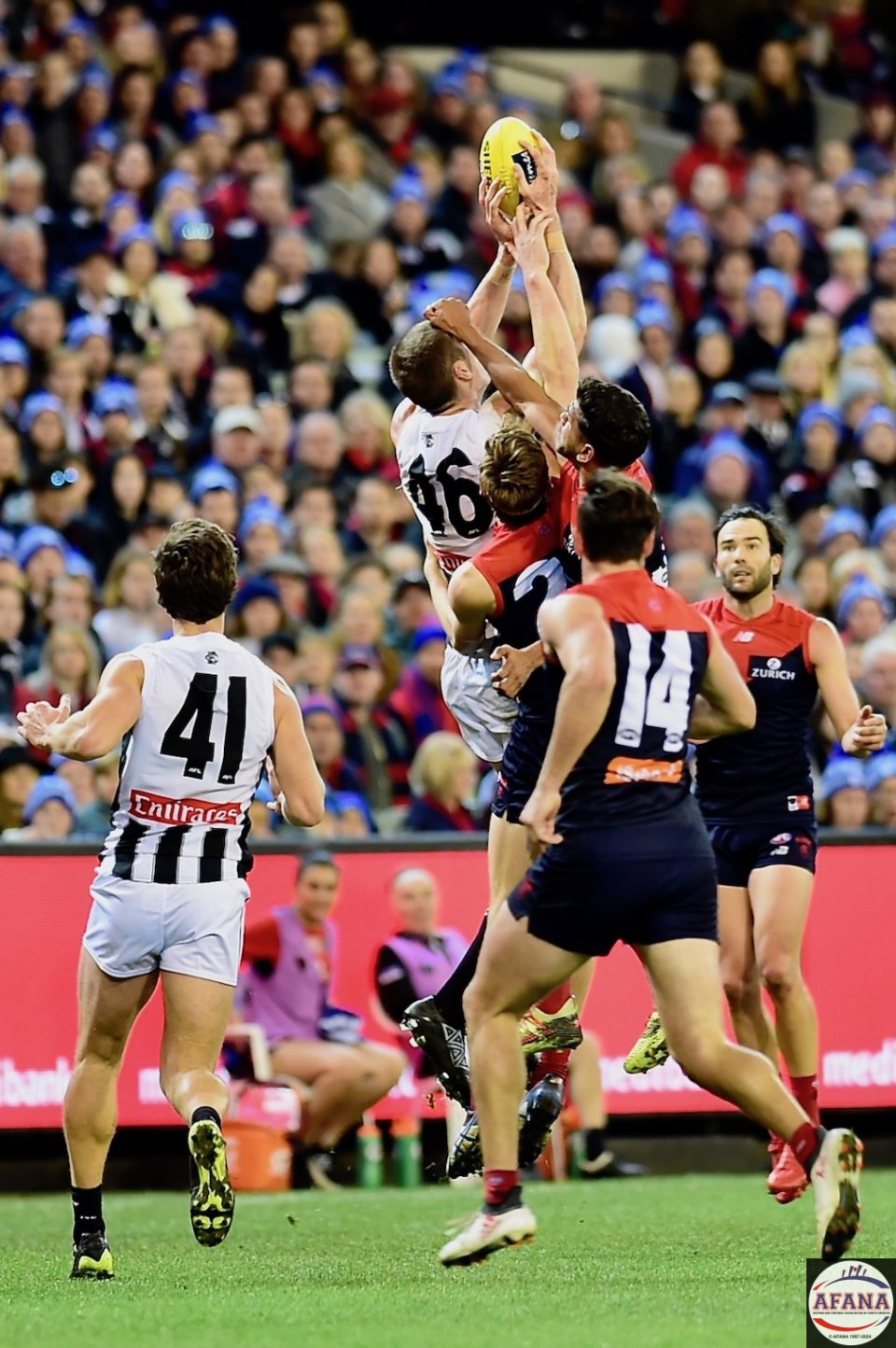 Mason Cox outreaches the Dees in a marking contest